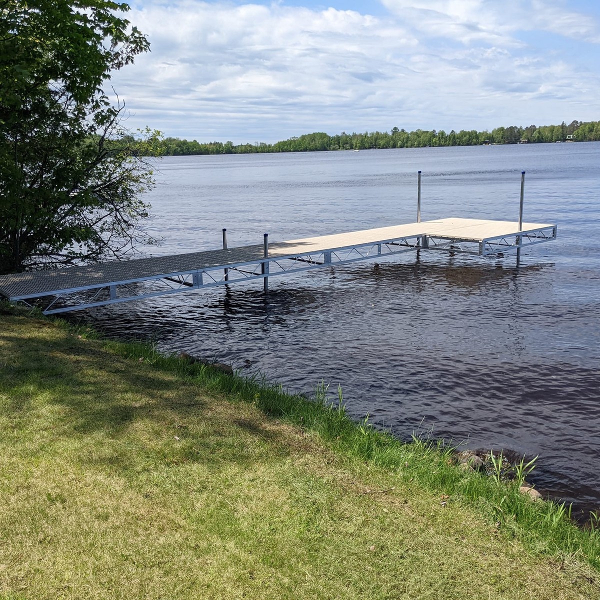 JB Lund aluminum kit dock on a clean shoreline