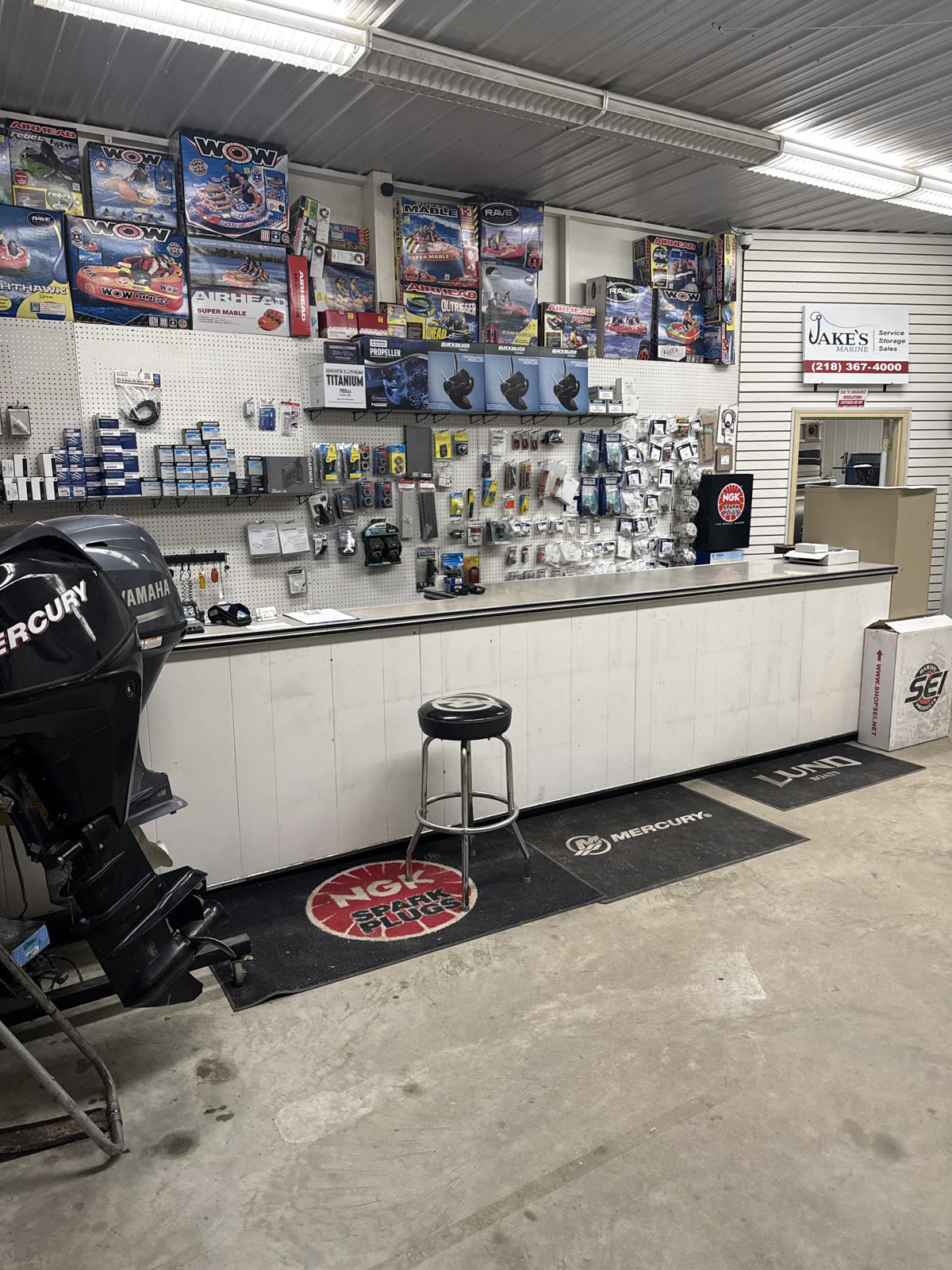 Parts counter inside Jake's Marine with marine parts and outboards